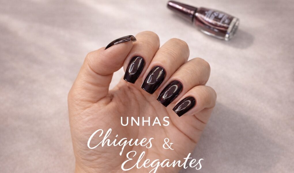 Unhas chiques e elegantes com esmalte preto e cintilância vinho