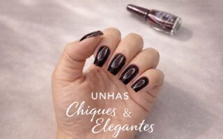 Unhas chiques e elegantes com esmalte preto e cintilância vinho