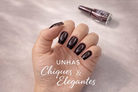 Unhas chiques e elegantes com esmalte preto e cintilância vinho